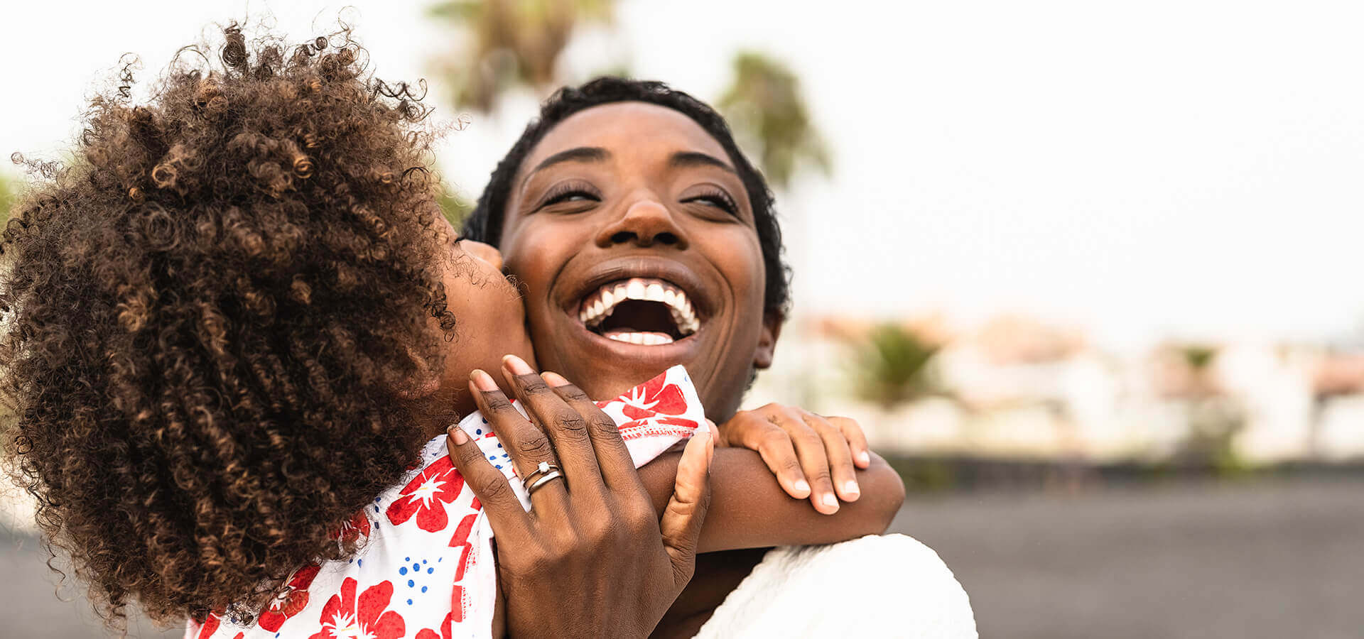 daughter hugging and kissing mother